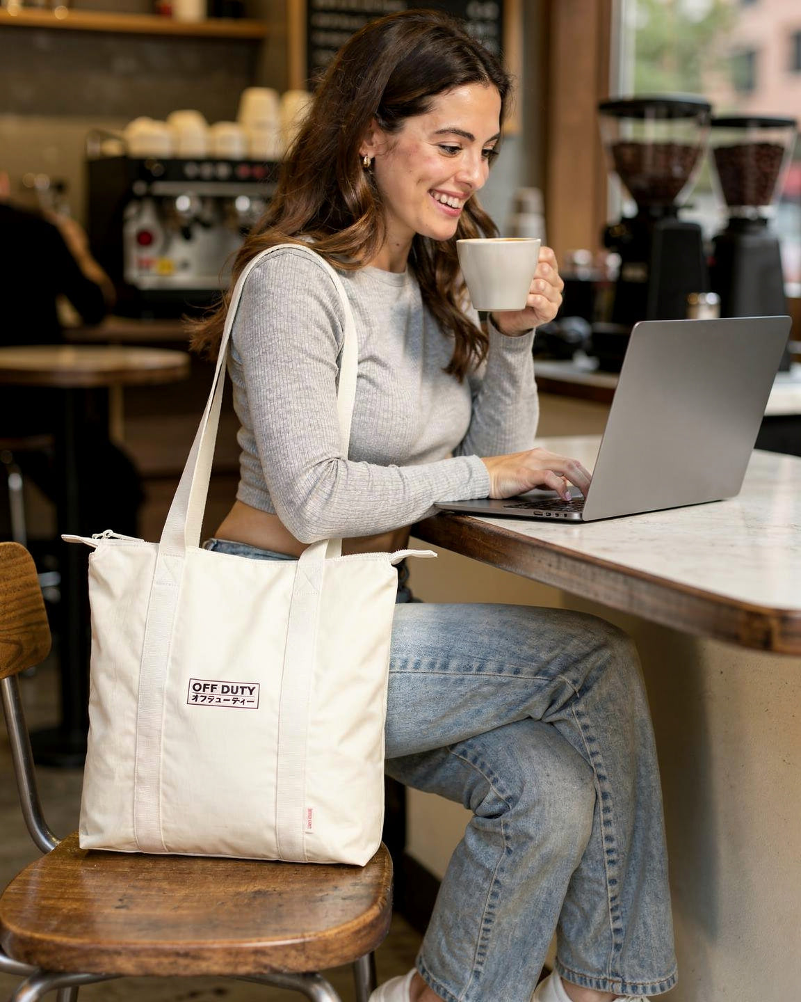 Off Duty Day Trip Tote in Ivory, working in a coffee shop — od-color:ivory