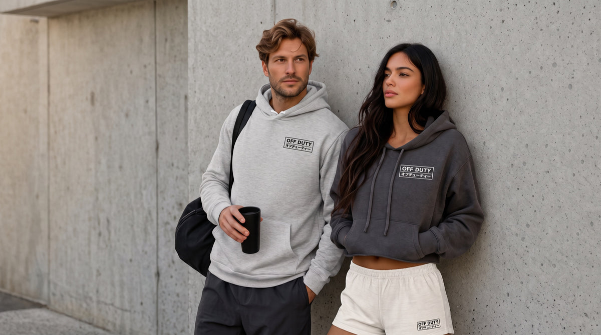 Two people in Off Duty hoodies, one holding a coffee cup
