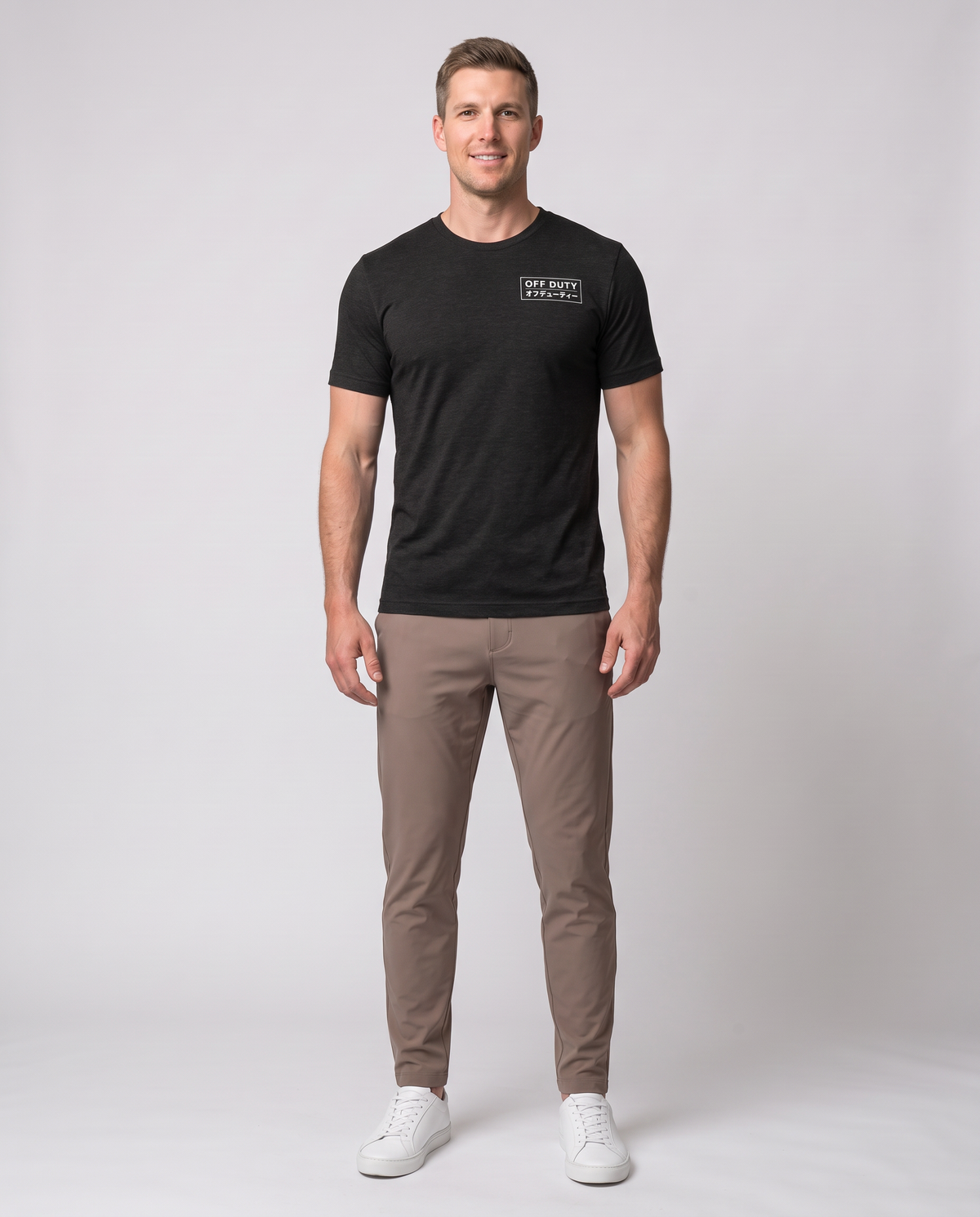 Off Duty Men's Triblend Tee in Black on a studio model, front-facing full-body view