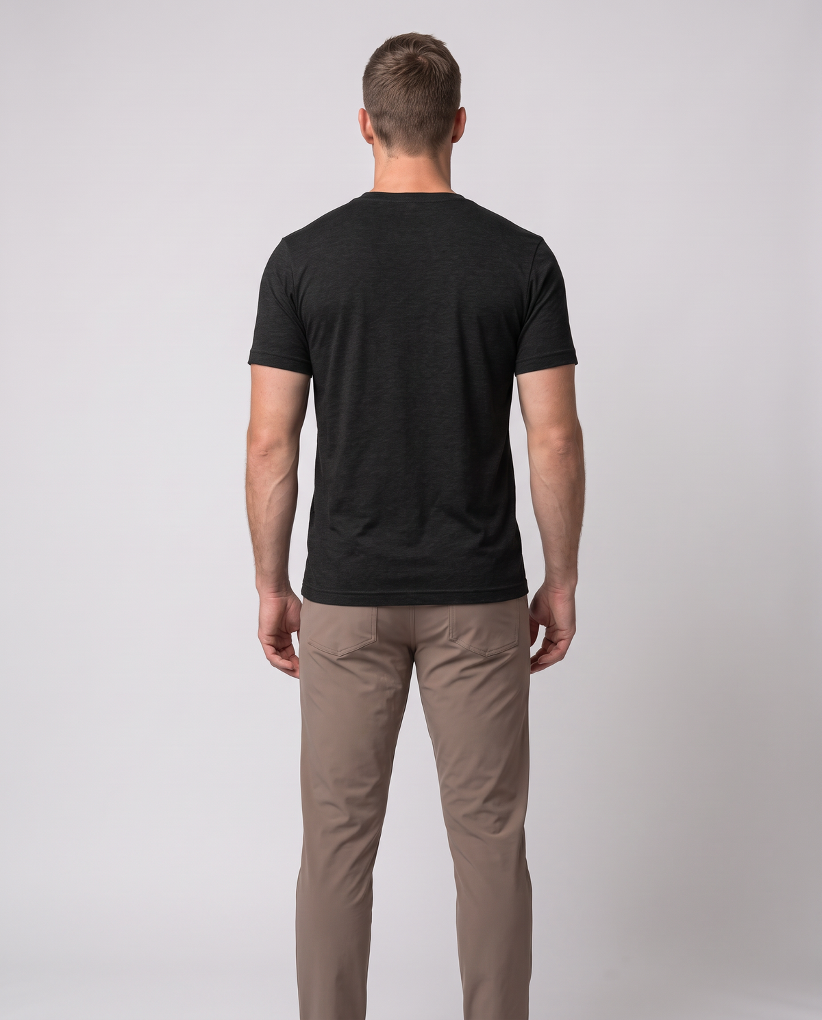 Off Duty Men's Triblend Tee in Black on a studio model, back-facing view