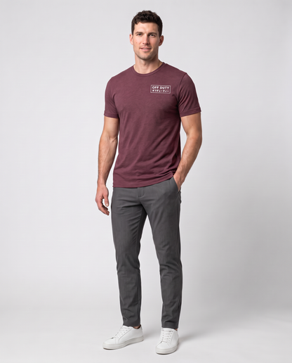 Off Duty Men's Triblend Tee in Red on a studio model, restored scene