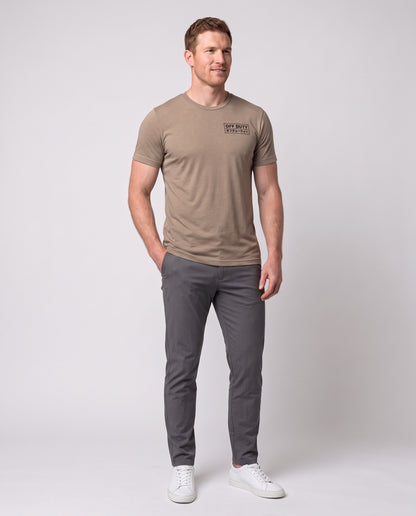 Off Duty Men's Triblend Tee in Tan on a studio model, three-quarter view