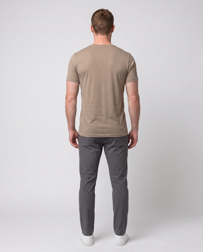 Off Duty Men's Triblend Tee in Tan on a studio model, back-facing view