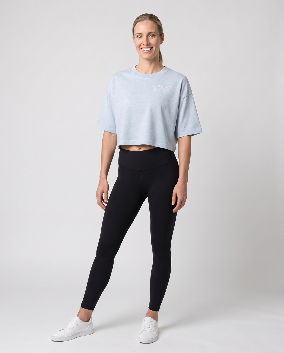 Off Duty The Weekend Cropped Tee in Light Washed Denim on model, scene 1 — od-color:light-washed-denim