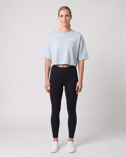 Off Duty The Weekend Cropped Tee in Light Washed Denim on model, scene 2 — od-color:light-washed-denim