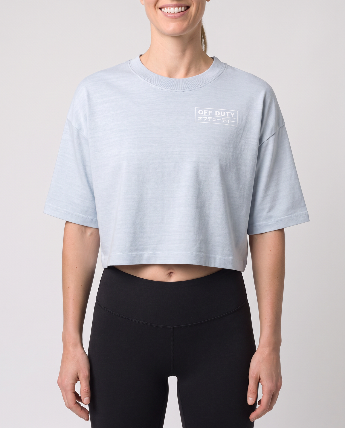 Off Duty The Weekend Cropped Tee in Light Washed Denim on model, scene 4 — od-color:light-washed-denim