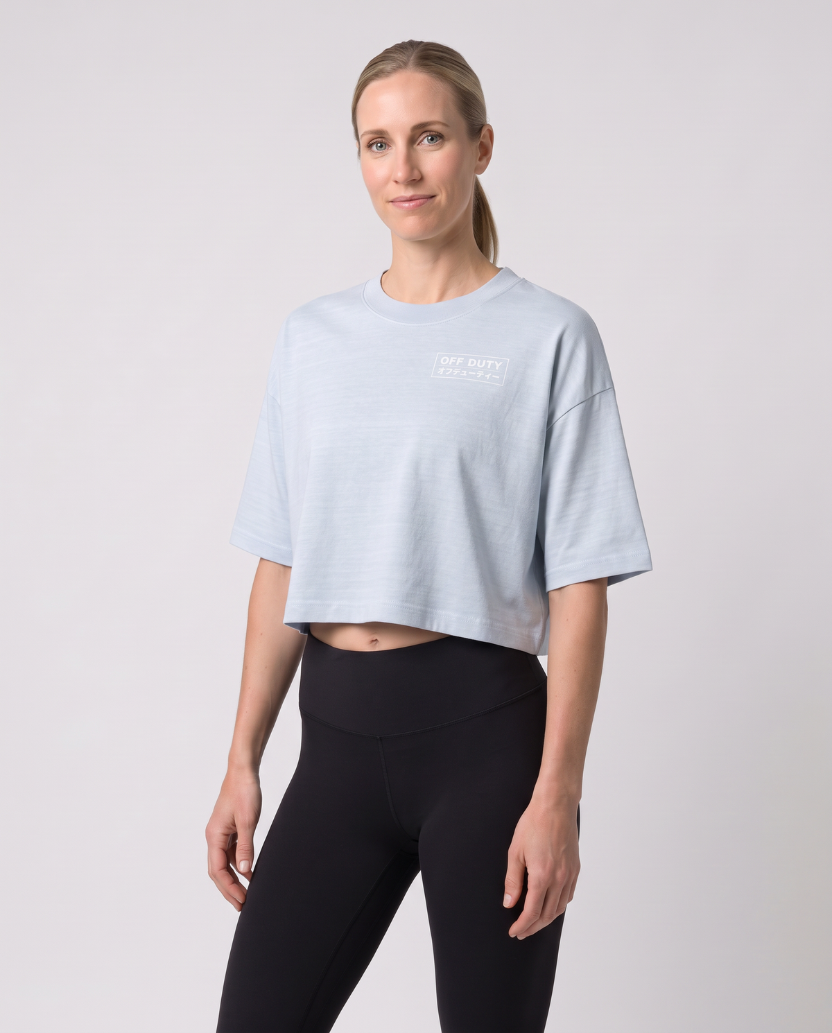 Off Duty The Weekend Cropped Tee in Light Washed Denim on model, scene 5 — od-color:light-washed-denim