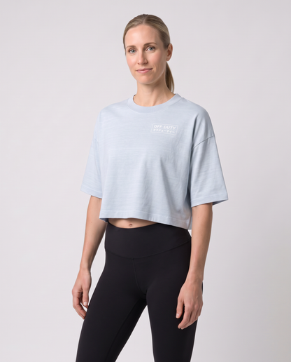 Off Duty The Weekend Cropped Tee in Light Washed Denim on model, scene 5 — od-color:light-washed-denim