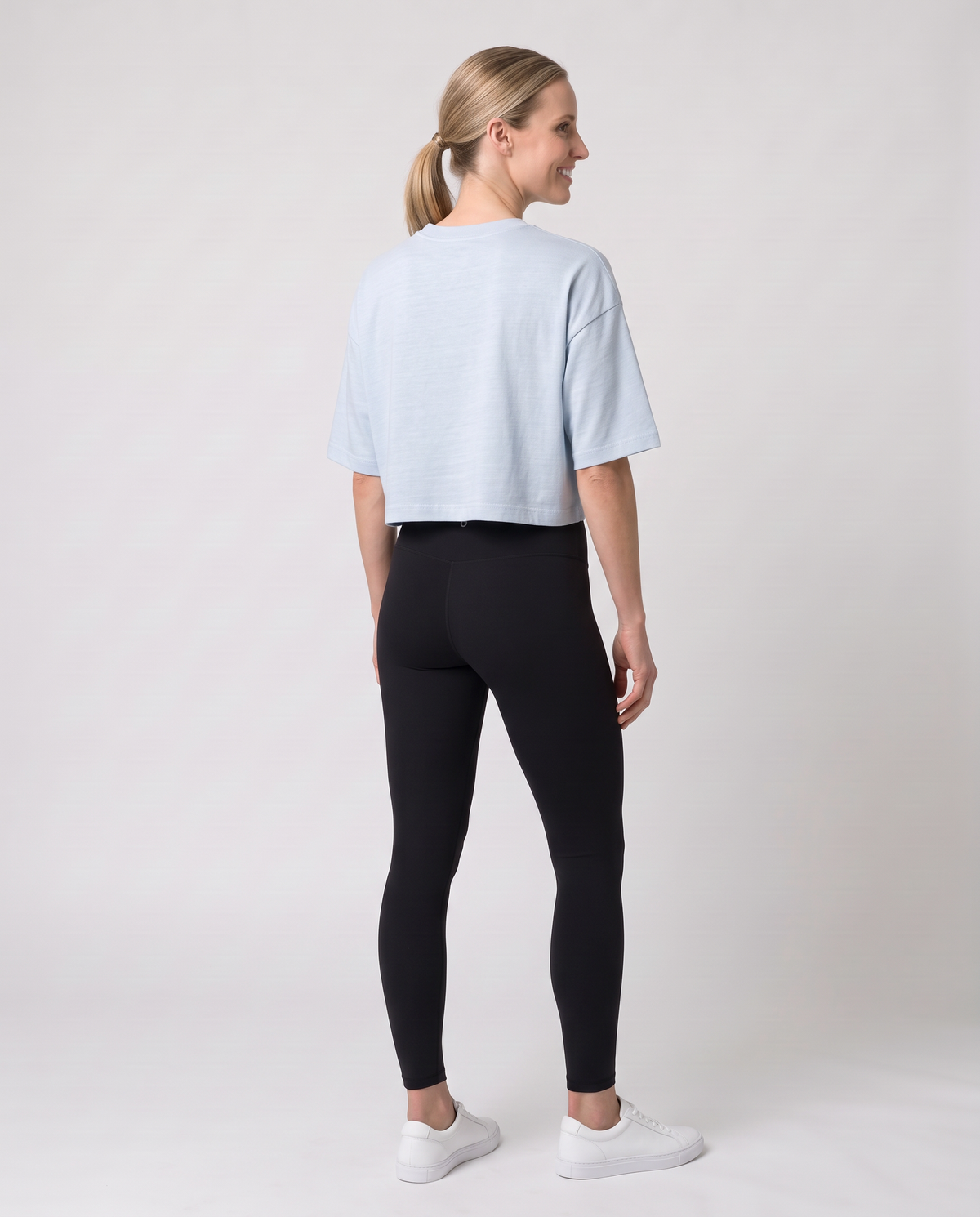Off Duty The Weekend Cropped Tee in Light Washed Denim on model, scene 6 — od-color:light-washed-denim