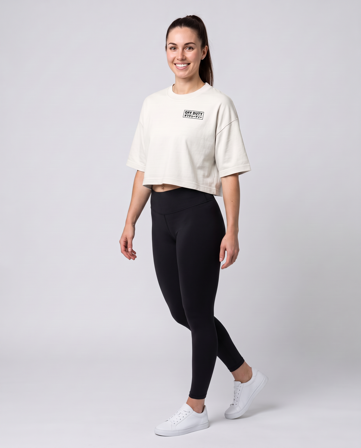 Off Duty The Weekend Cropped Tee in Vintage White on model, scene 1 — od-color:vintage-white