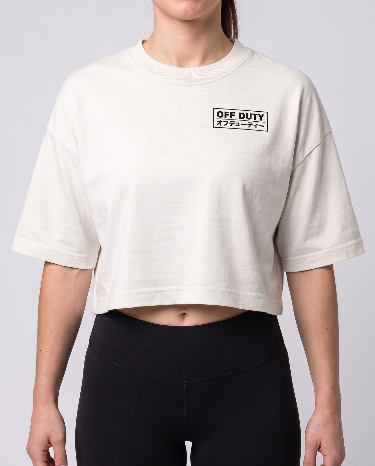 Off Duty The Weekend Cropped Tee in Vintage White on model, scene 4 — od-color:vintage-white