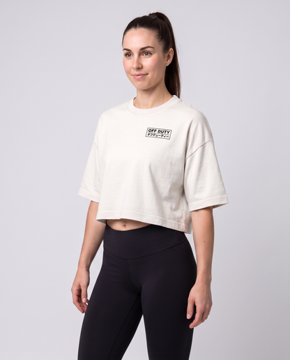 Off Duty The Weekend Cropped Tee in Vintage White on model, scene 5 — od-color:vintage-white